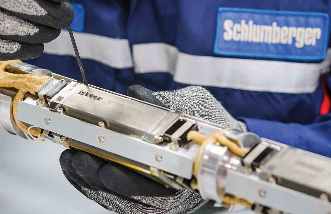 A Schlumberger technician working on the internal components of a PowerDrive ICE RSS