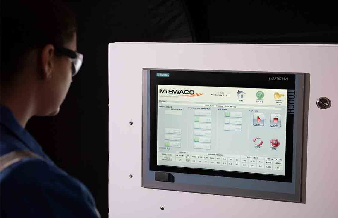 Operator look at a computer screen with rheological tests displayed