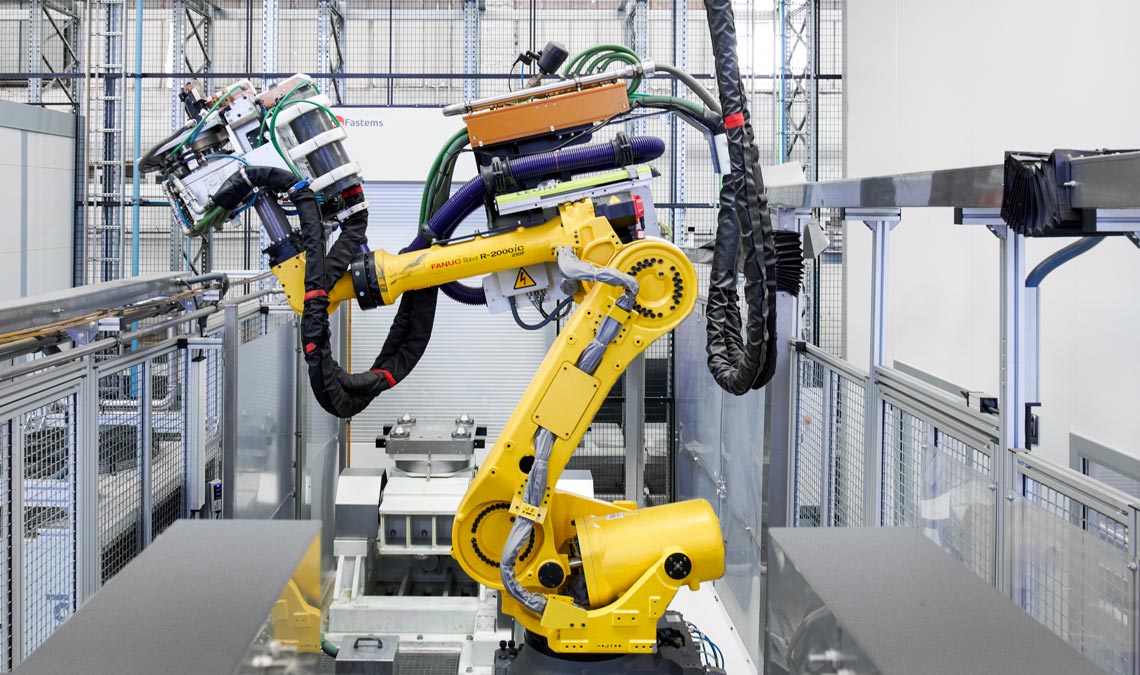 Robot arm in a manufacturing facility